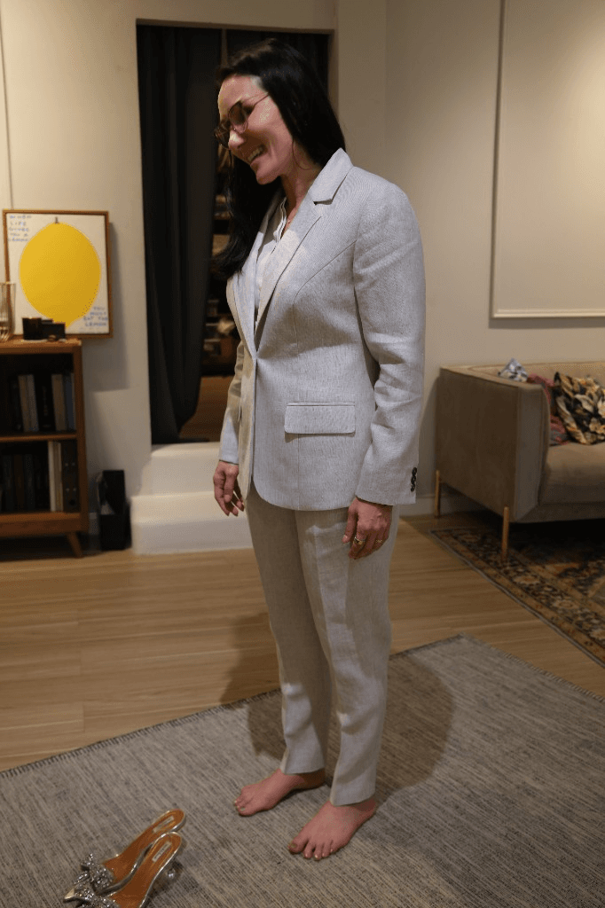 Woman wearing light grey beige two-piece suit