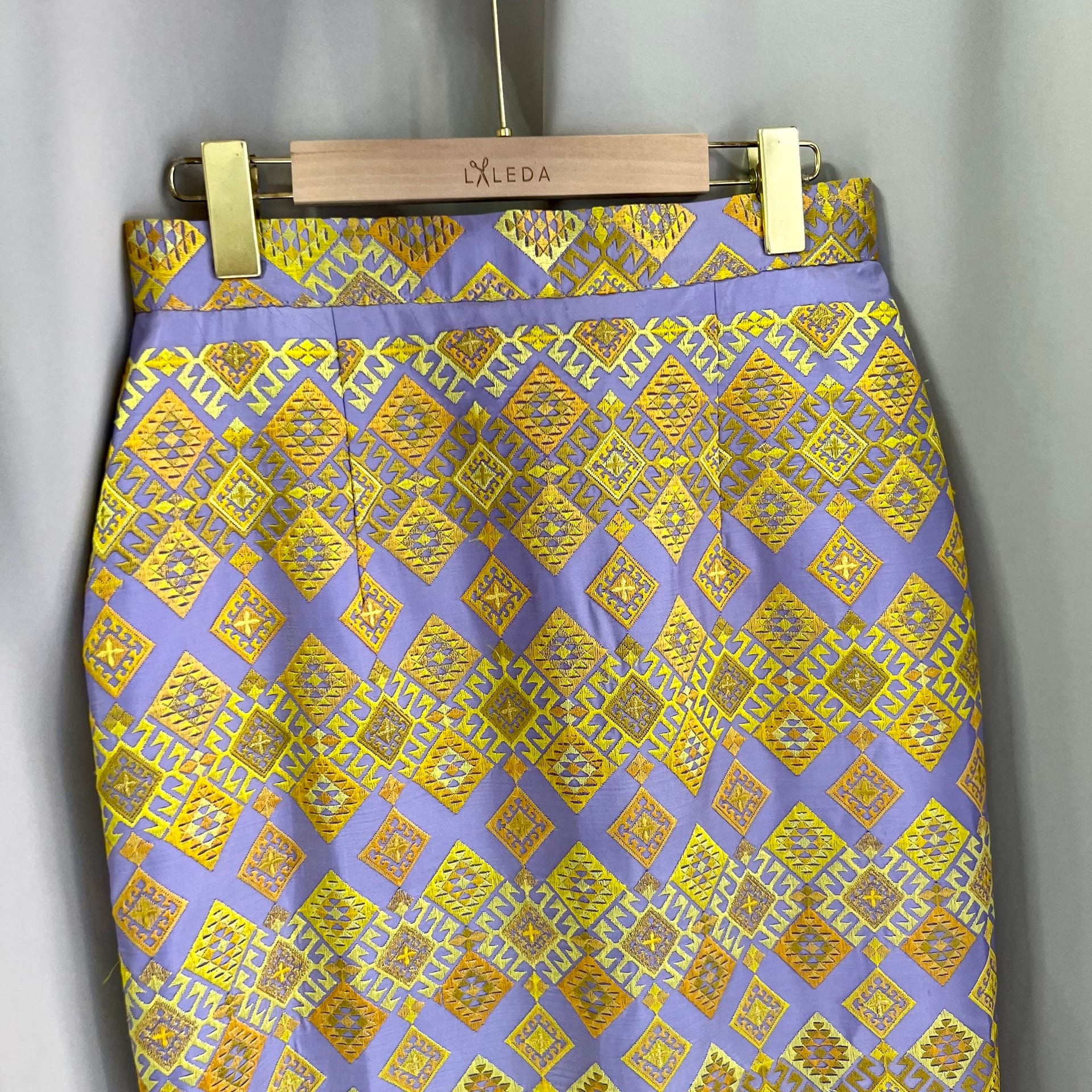 Lilac and gold geometric brocade pencil skirt on a LALEDA hanger