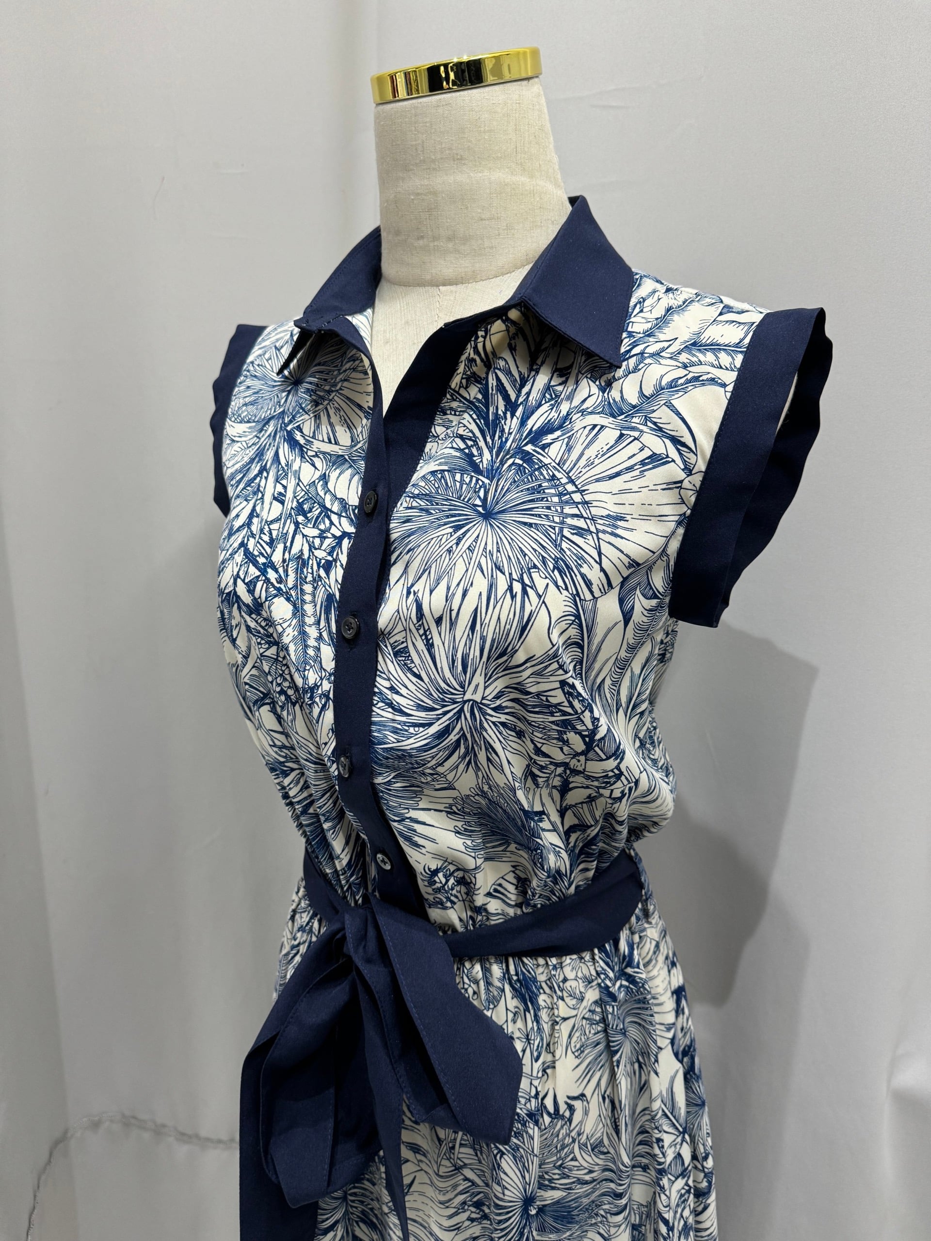 Navy and white floral sleeveless dress with trim detail
