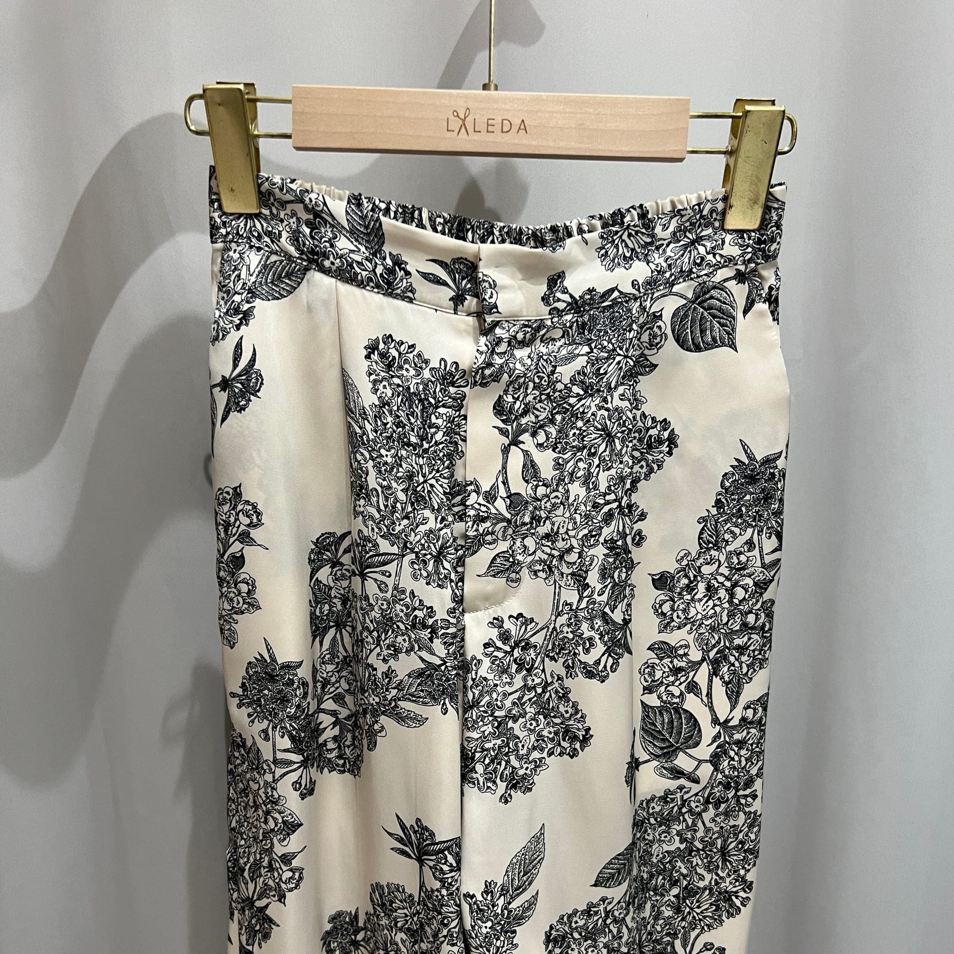 Black tailored women's trousers with lace detail