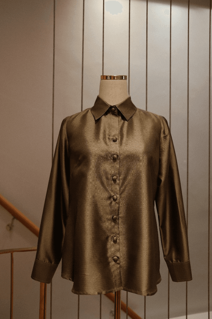 Custom tailored blouse in shimmering bronze-olive textured fabric with fabric-covered buttons