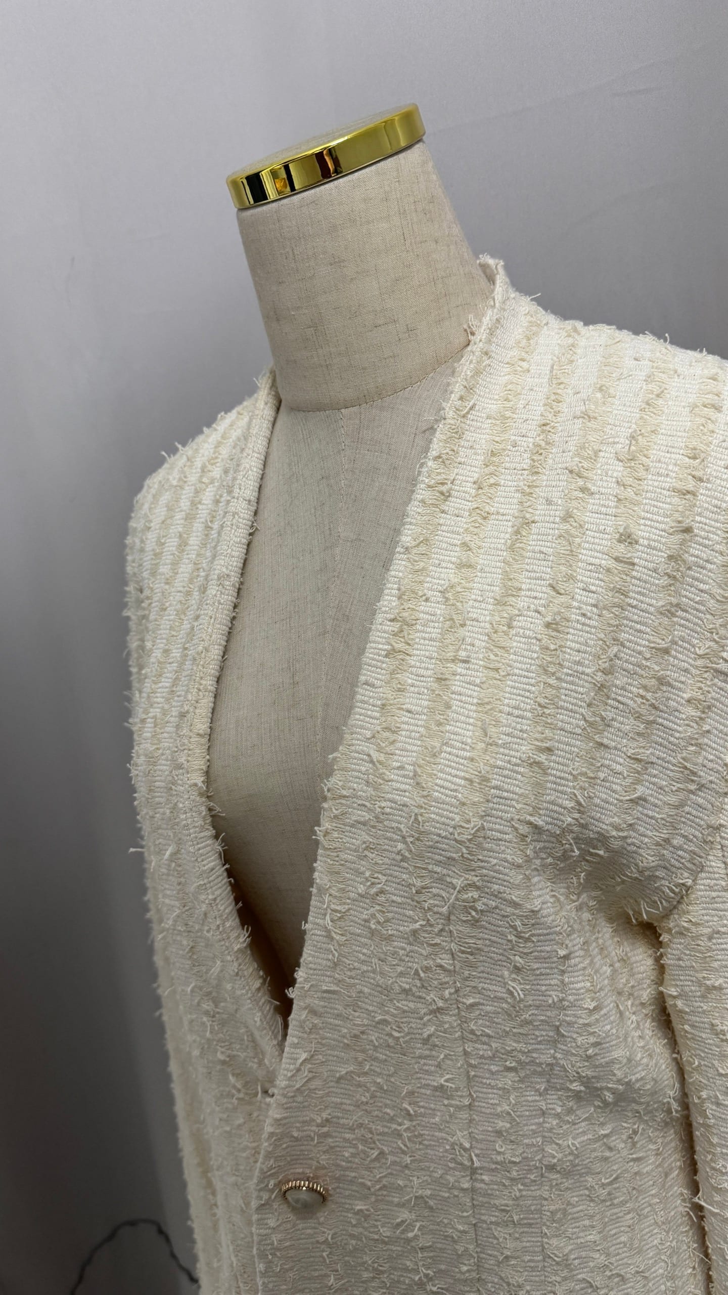 Cream textured blazer with wavy pattern