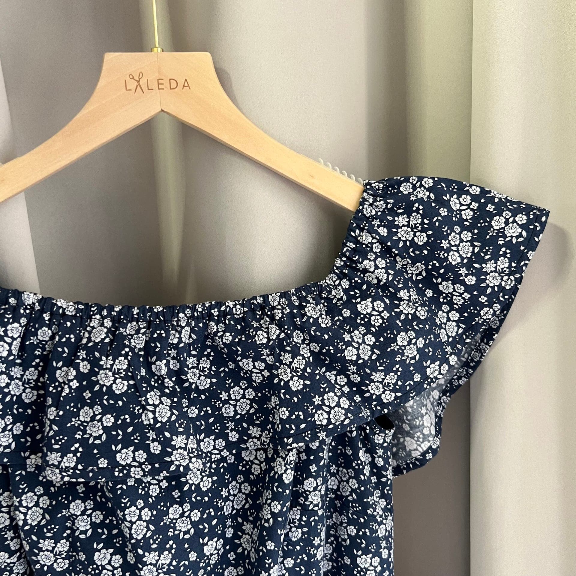 Ivory organza cocktail dress with bow waist detail