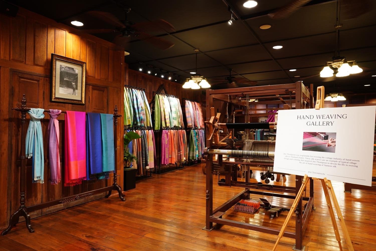 Handweaving gallery at Jim Thompson Surawong with silk scarves and a loom