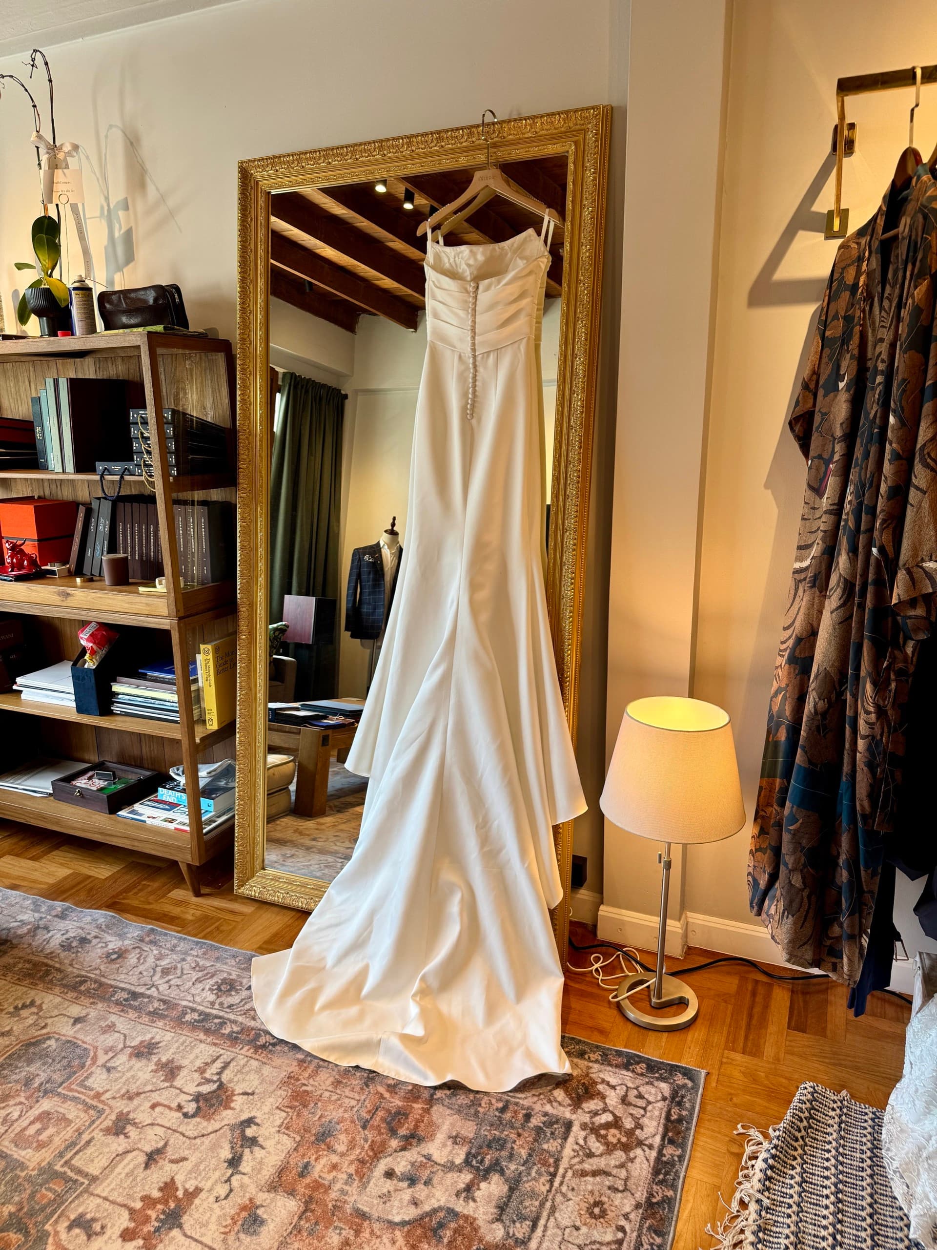 Ivory silk blouse with hand-stitched pearl buttons