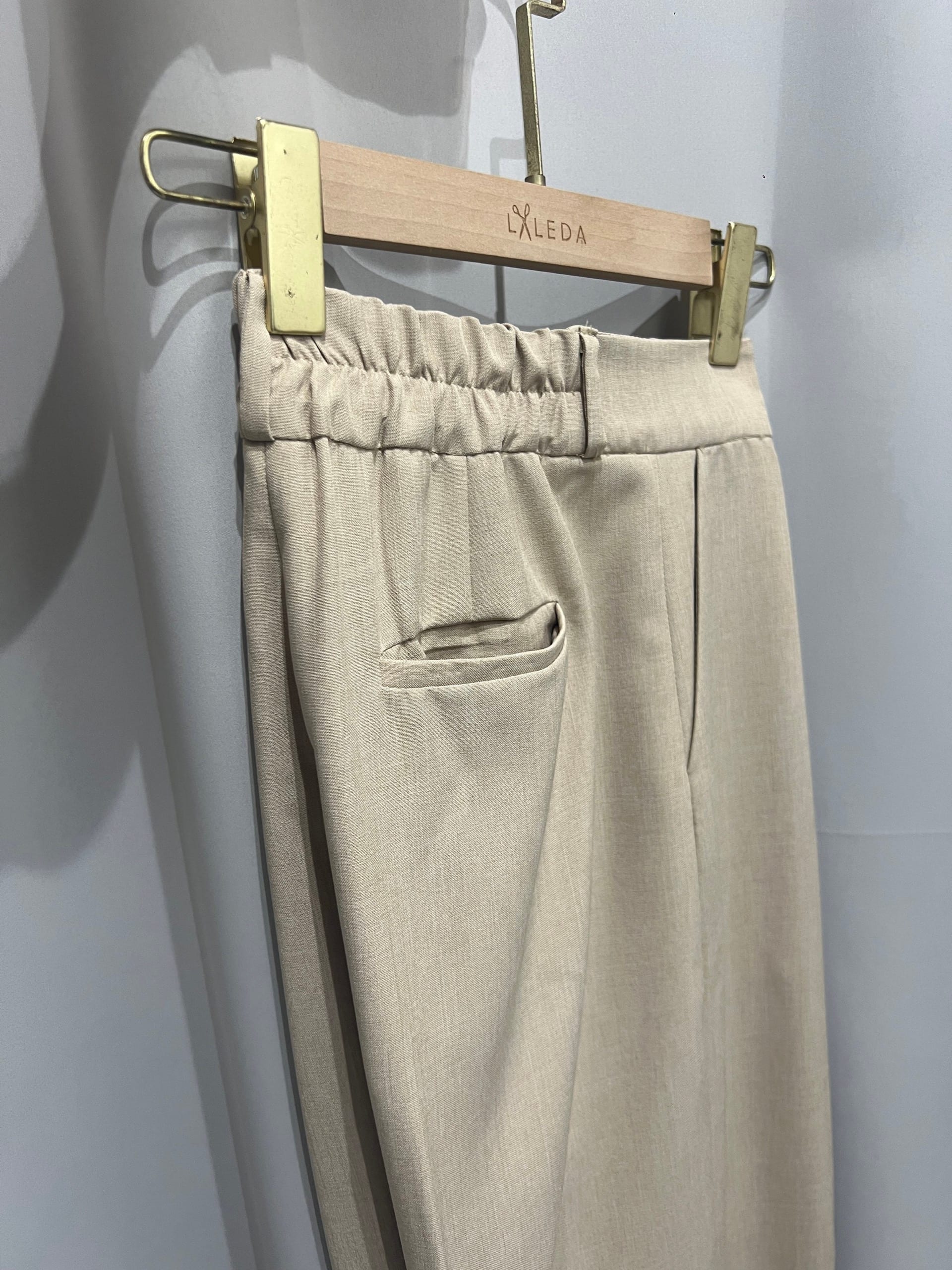 Light beige tailored trousers with elastic waistband
