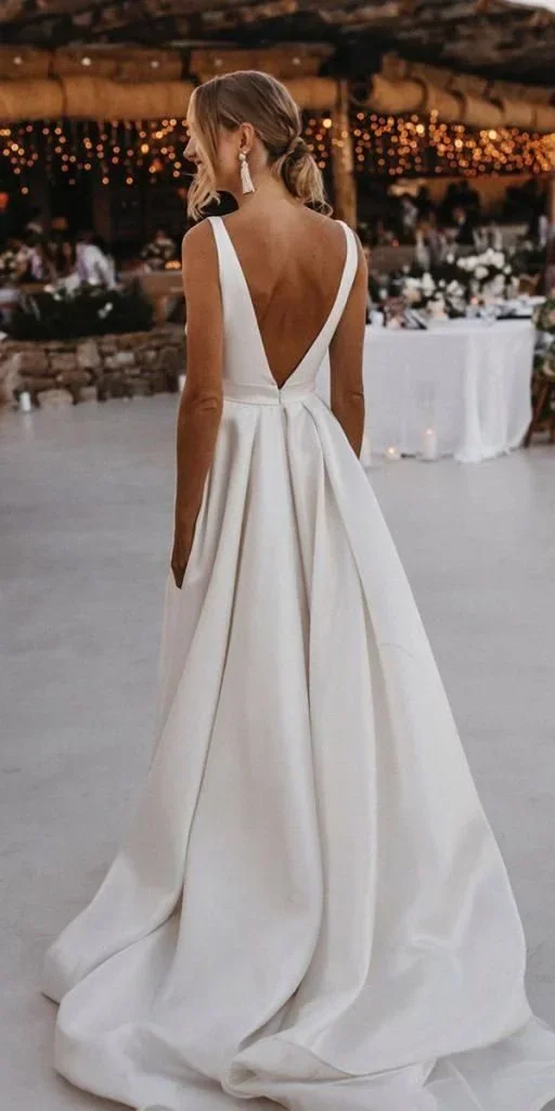 Long white wedding dress with an open back