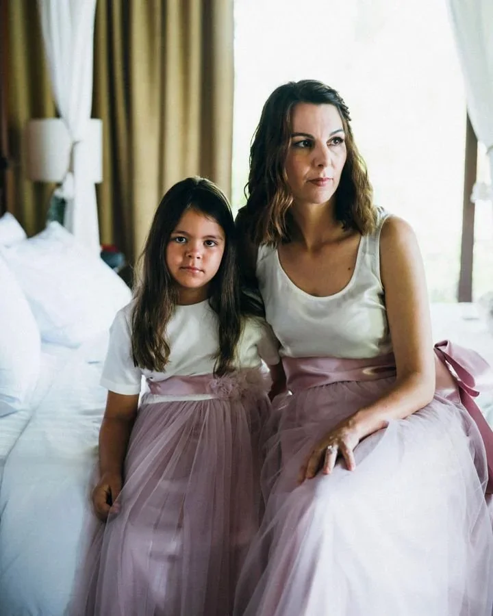 Michelle the bride with her four daughters in matching lilac dresses