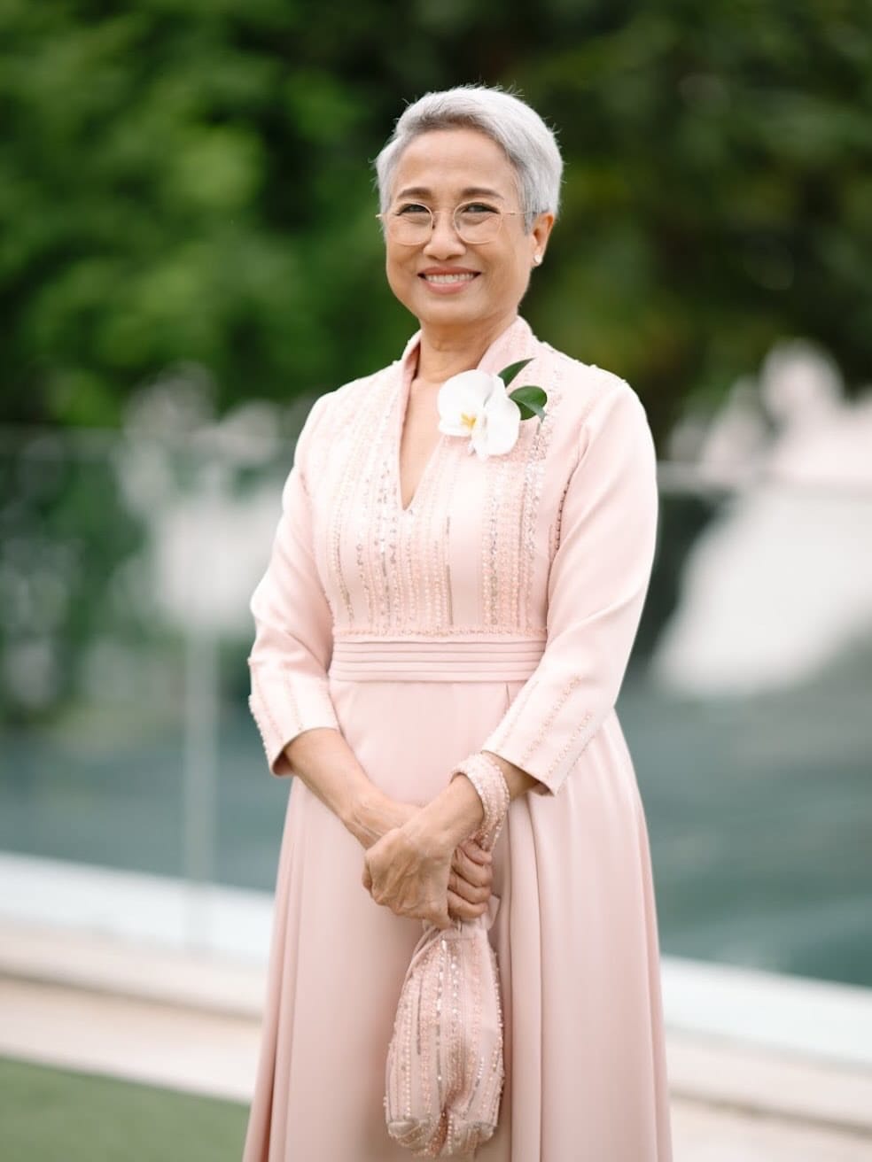 Close portrait of mother of the bride in a custom blush beaded gown
