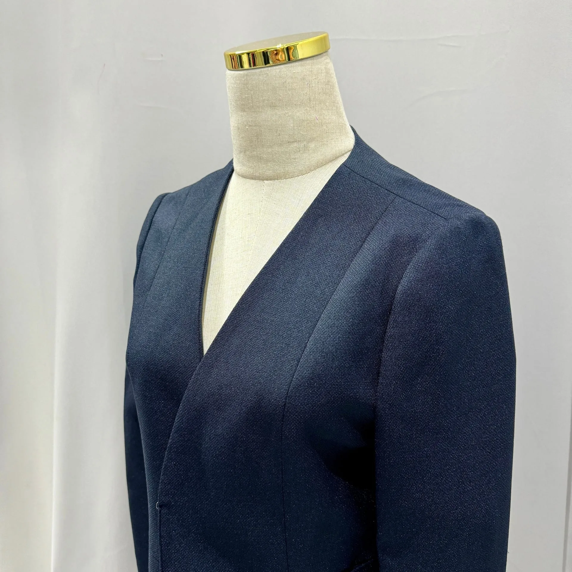 Navy blue wool women's blazer on a mannequin at LALEDA