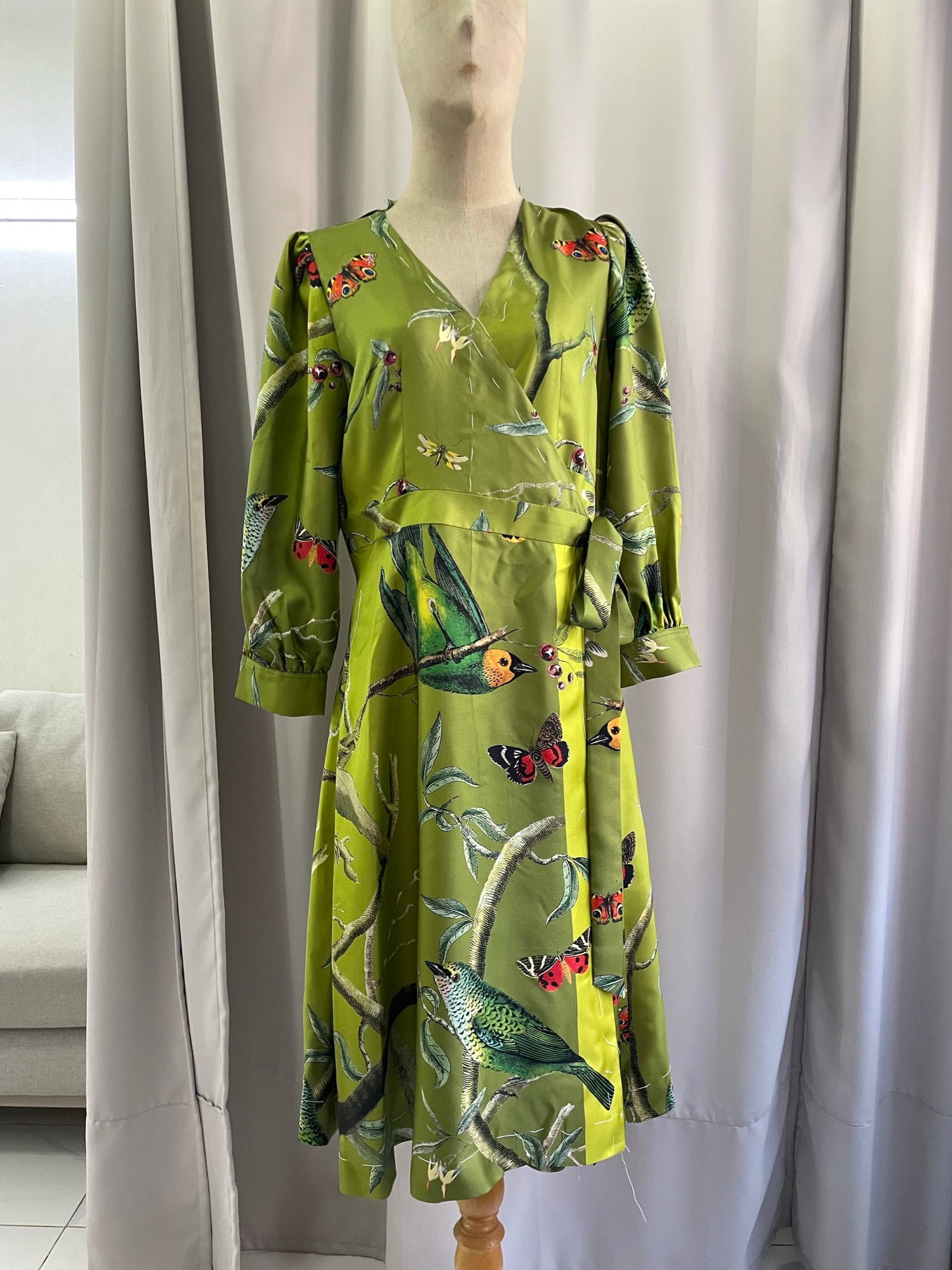 Olive green silk dress with bird embroidery and kimono-style sleeves