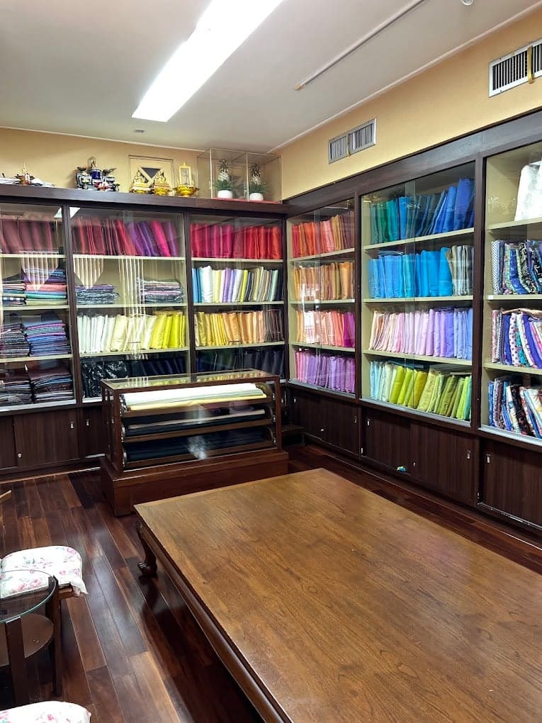 Phanthip Thai Silk showroom with glass cabinets of silk bolts