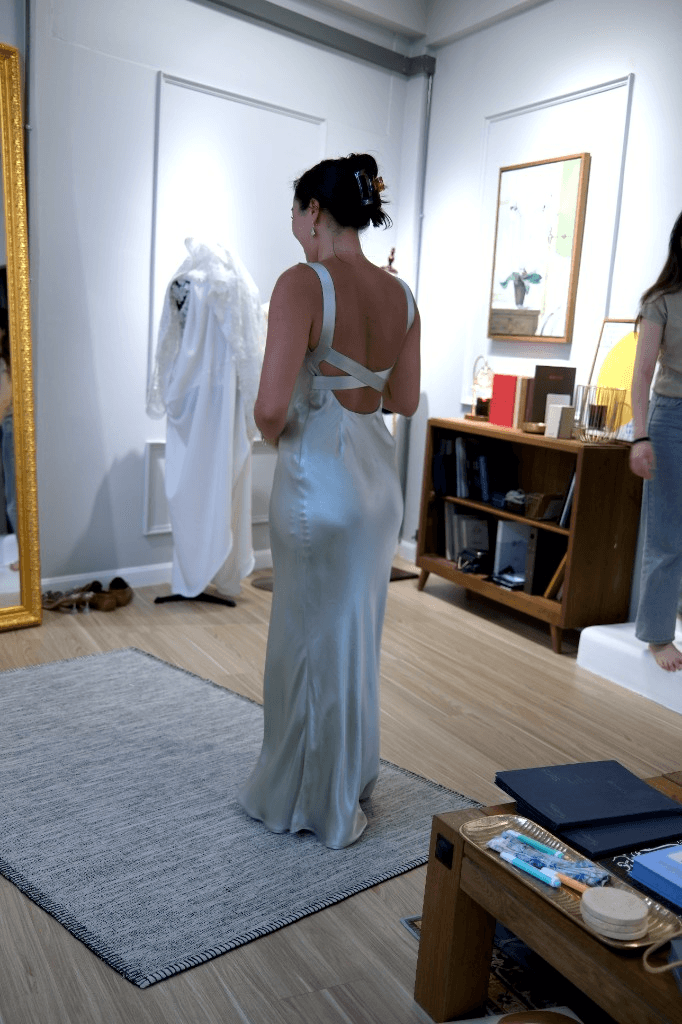 Pale sage satin backless gown with criss-cross straps