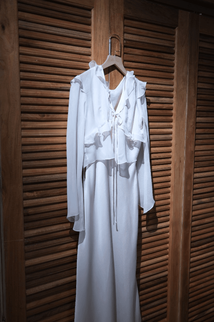 Cream silk kimono-style maxi dress with ruffled V-neck and flowing sleeves