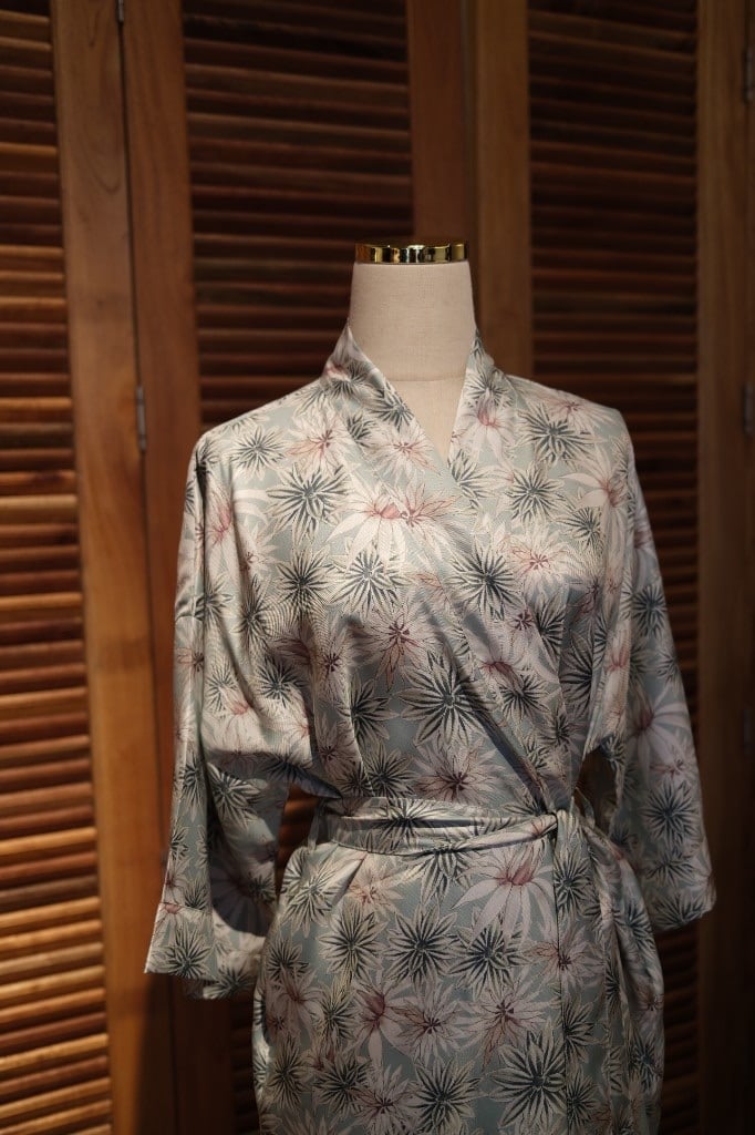 Floral mint and blue silk kimono-style dress on a mannequin