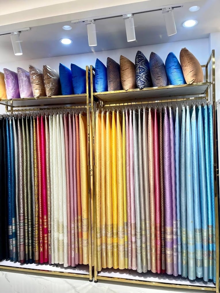 Rainbow of Thai silk bolts and cushions at Sukjai Thaisilk