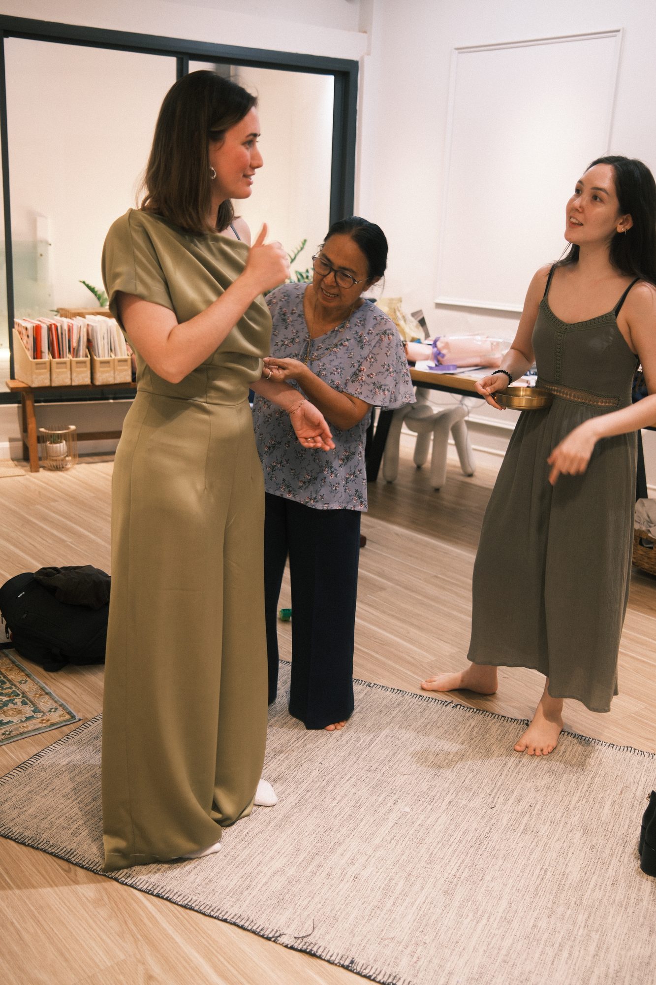 A LALEDA tailor working closely with a client during a fitting