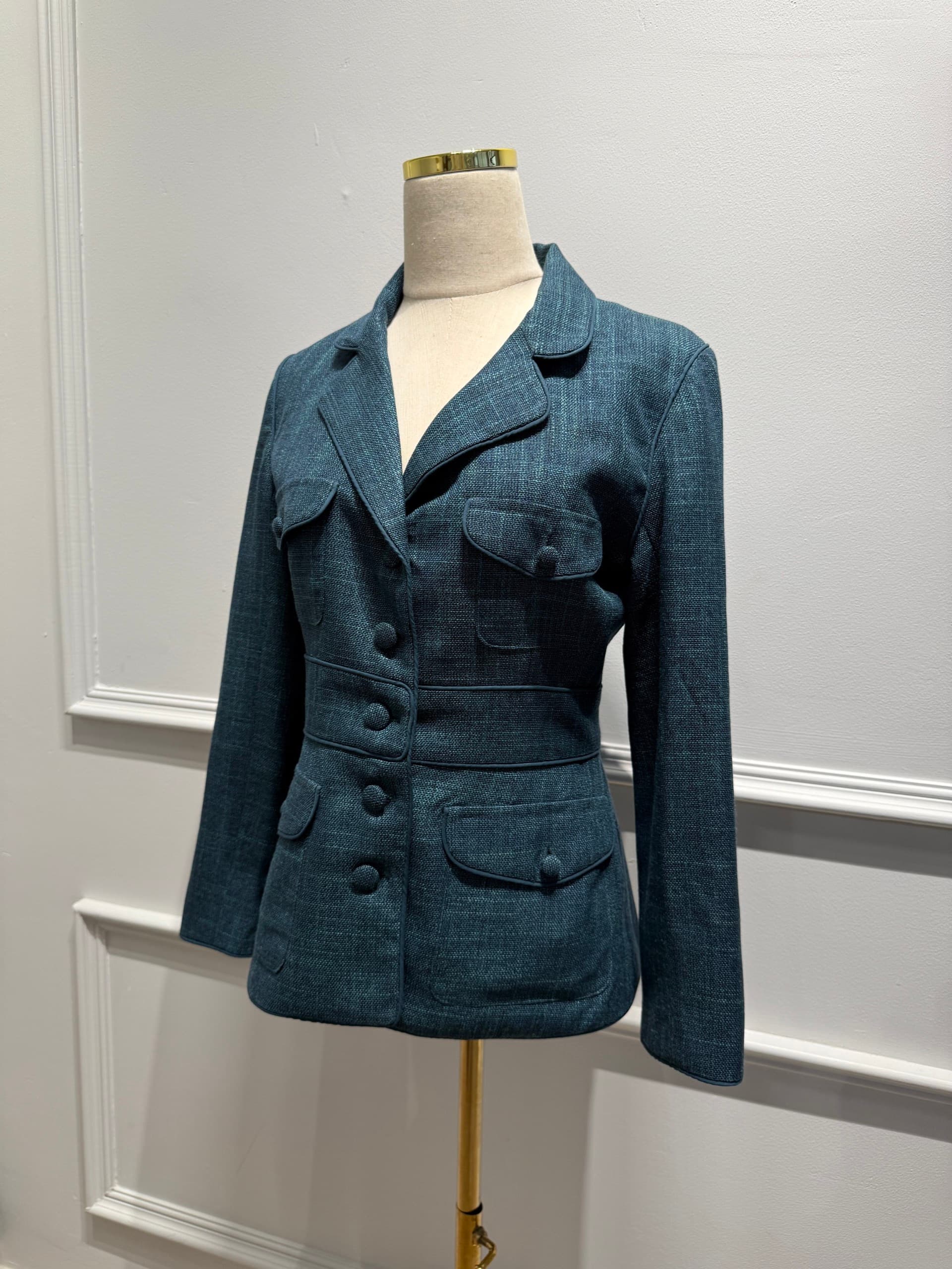 Teal textured fitted blazer with flap pockets