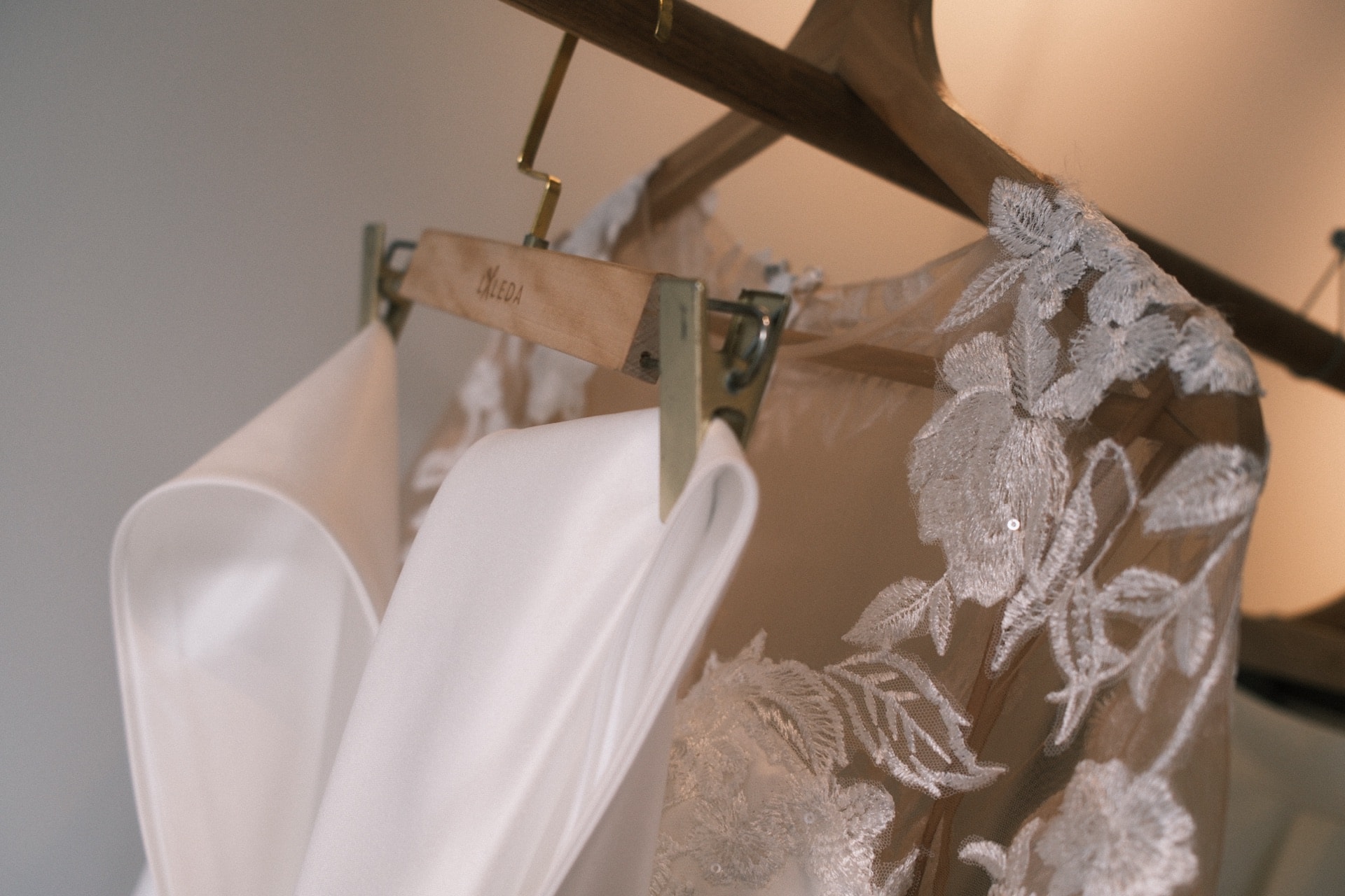 Wedding lace gown detail on a LALEDA wooden hanger