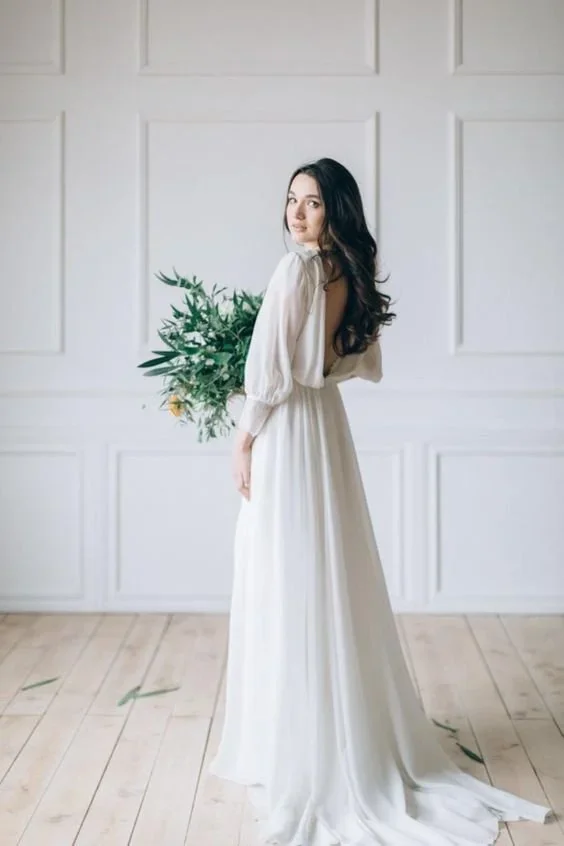 Bride in a white wedding dress holding her bouquet